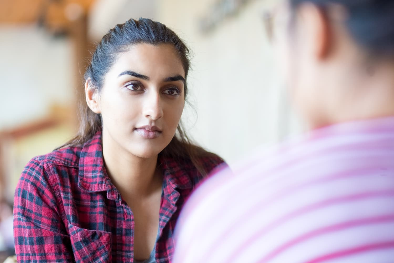 Picture of a woman looking intently at another person