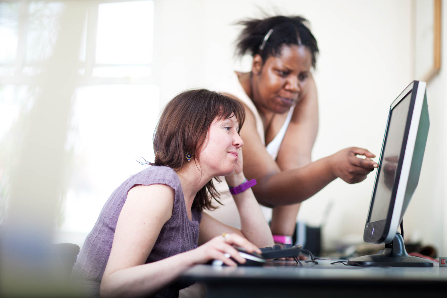 banner of staff at a computer