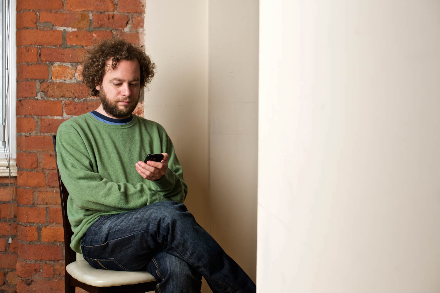 man looking at mobile phone